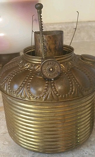 Clean, replace wick and fix leak on oil lantern 